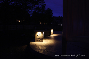 Under railing LEDs on seating wall.