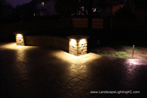 Under railing LEDs on seating wall.