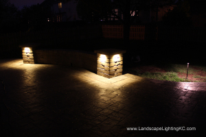 Under railing LEDs on seating wall.